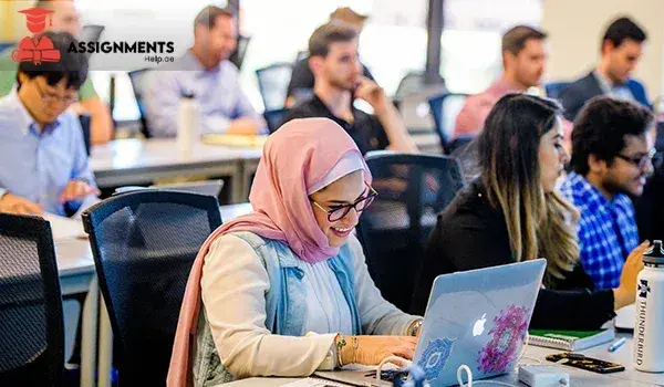 University students in Dubai working on laptops for online assignment help