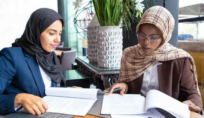 University students in Dubai working on laptops for online assignment help